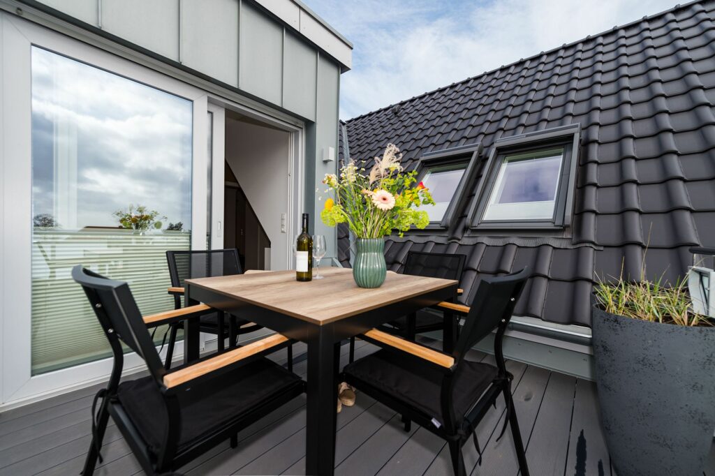 Ferienwohnung Grömitz mit Dachterrasse mit Tisch für vier Personen